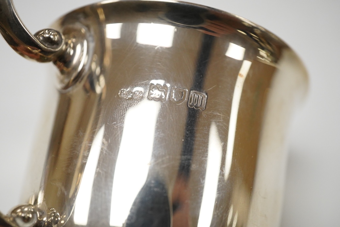 An Edwardian silver christening mug, wit engraved initials, Robinson & Co Ltd, London, 1907, height 99mm and one other smaller silver christening mug, James Dixon & Sons, Sheffield, 1907, 8.3oz.